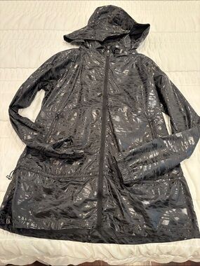 Women's Black Hooded Trench Coat with Subtle Sheen. Hidden hooded